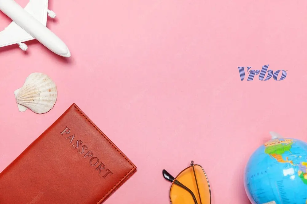Vrbo travel graphic with passport and sunglasses on a pink background