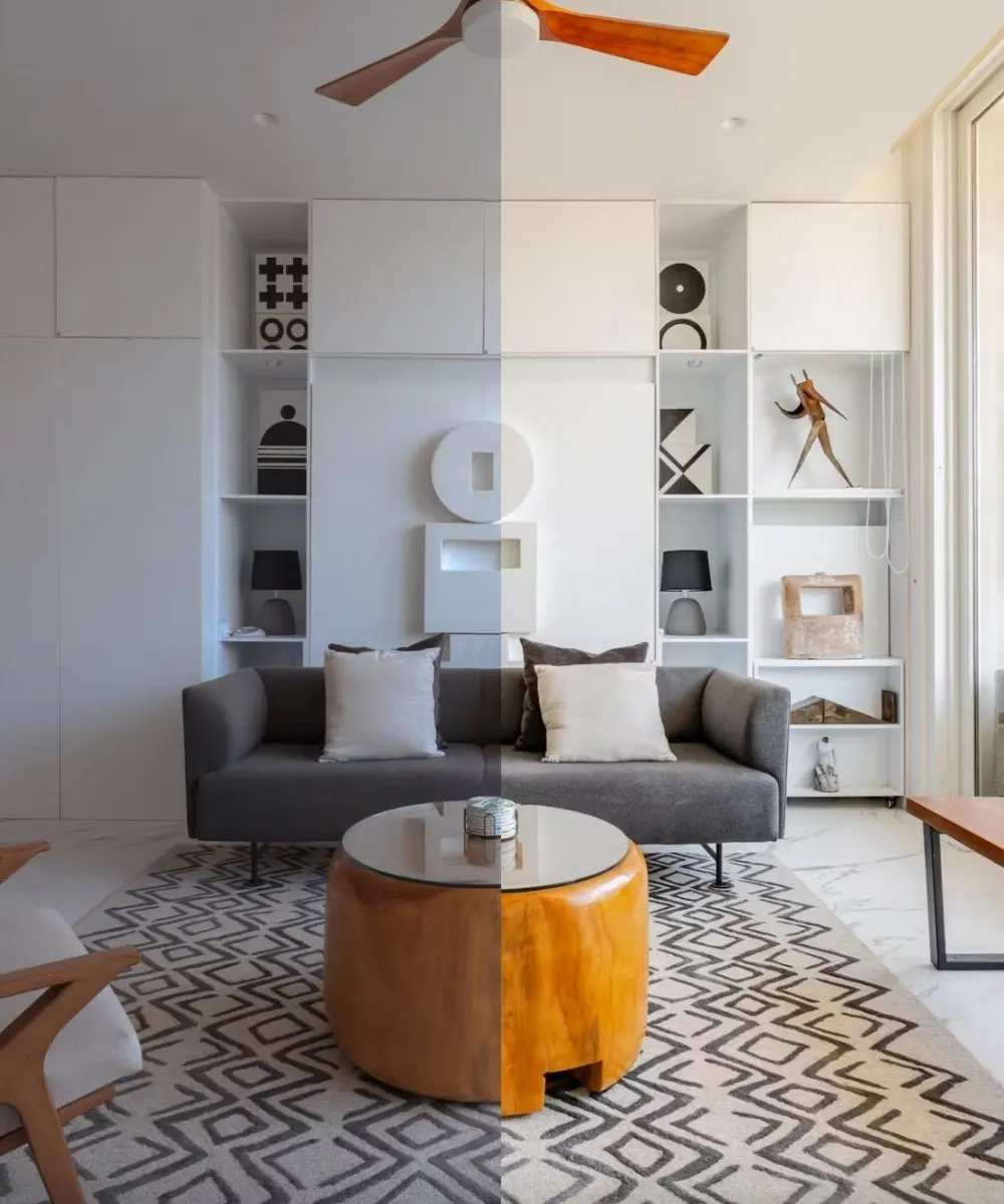 Salon avec canapé gris, tapis à motifs et étagères intégrées