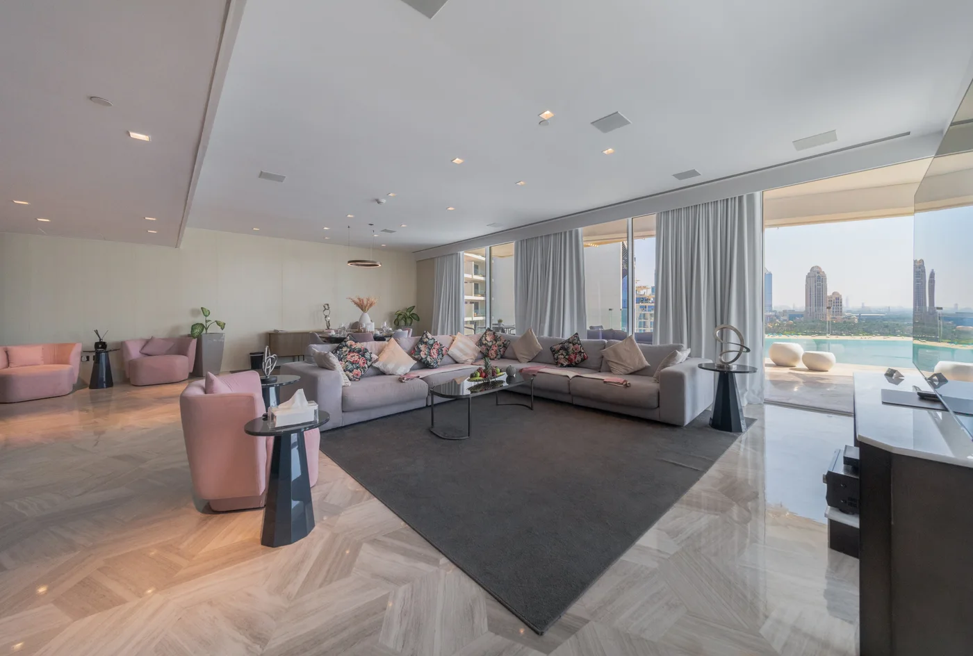 Living room opening onto the private terrace of the three-bedroom FIVE Palm penthouse